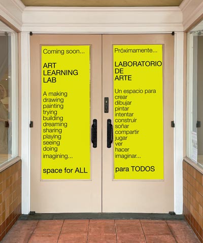 mockup of entrance to the new Art Learning Lab doors and signage, flanked by windows and art displays