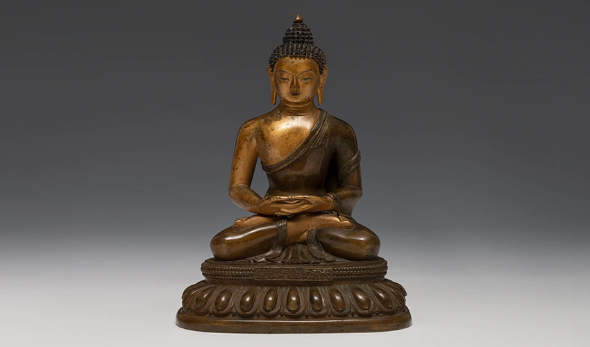 photo of a sitting buddha sculpture in bronze