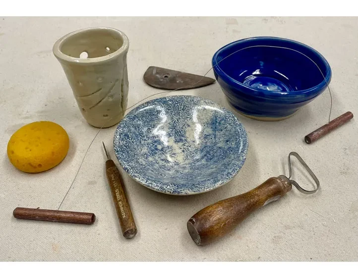 photo of ceramics making materials including bowl and tools