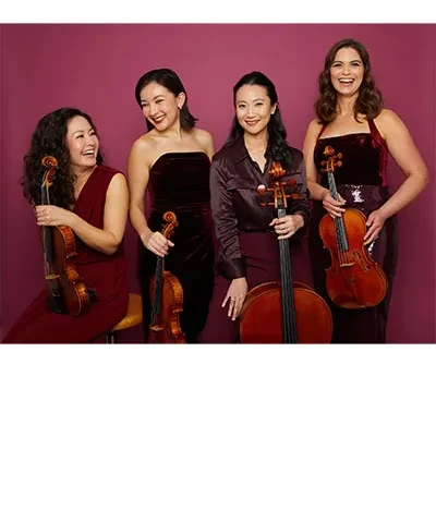 photo of quartet of string musicians holding their instruments against a maroon backdrop