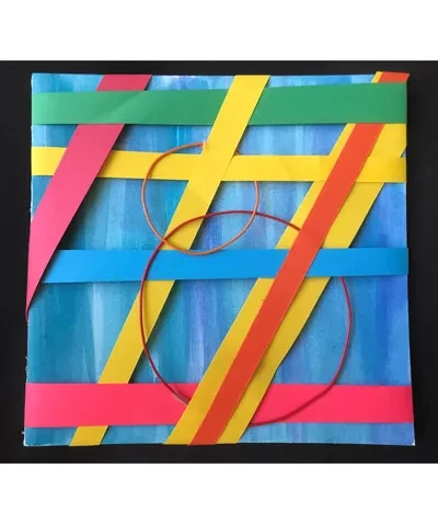 photo of crafted colored paper square in primary colors of red, blue, green, and yellow