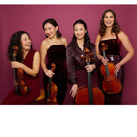 photo of quartet of string musicians holding their instruments against a maroon backdrop