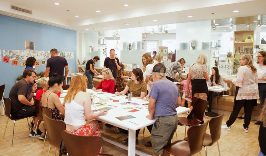 Photo of group of adults crafting at a table